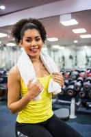 Fit woman working out in weights room
