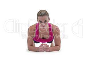 A muscular woman on a plank position