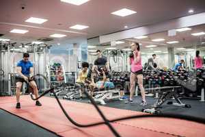 Fit people working out in weights room