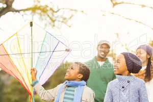 Young family playing with a kite