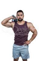 Muscular serious man holding a kettlebell