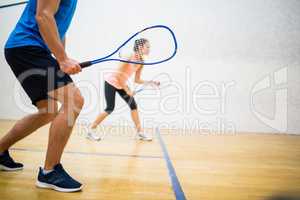 Woman about to serve the ball