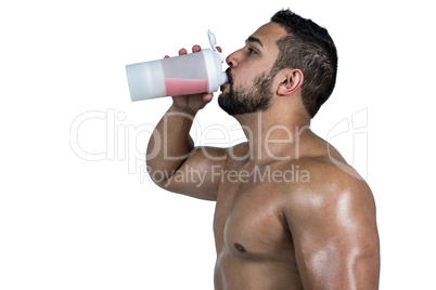 Muscular man with protein powder