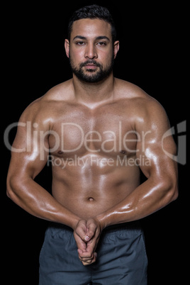 Portrait of a bodybuilder man flexing muscles