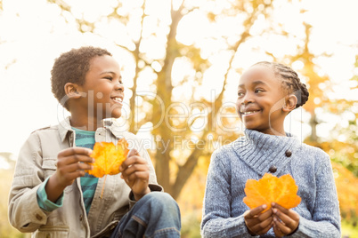 Portrait of young children holding leaves