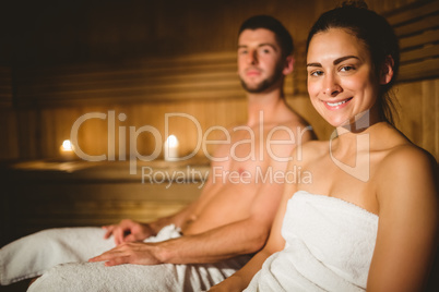 Happy couple enjoying the sauna together