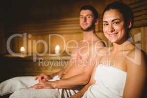 Happy couple enjoying the sauna together