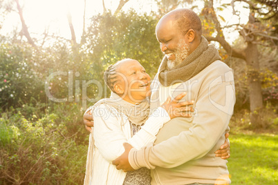 Happy peaceful senior couple embracing
