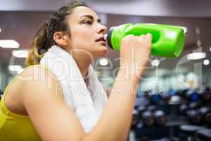 Woman taking a drink from her water bottle