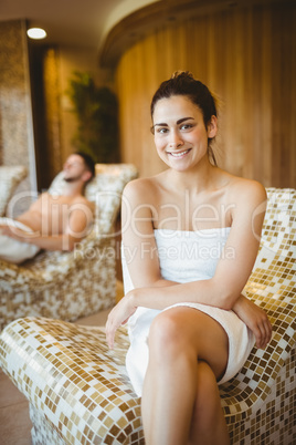 Smiling woman sitting on a chair
