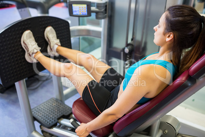 Focused woman doing leg training