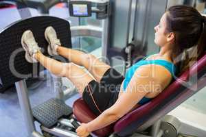 Focused woman doing leg training