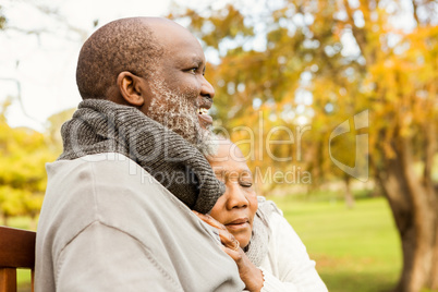 Peaceful senior couple sitting on a bench