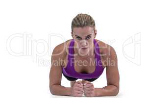 Muscular woman doing push ups