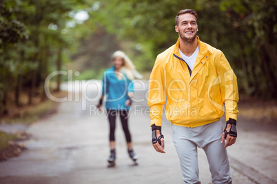 Happy couple roller blading together