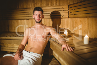 Man sitting inside a sauna