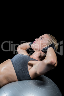 Muscular woman doing sit ups