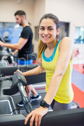 Couple using treadmills together