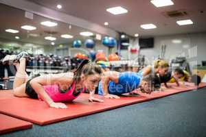 Fit people working out in fitness class