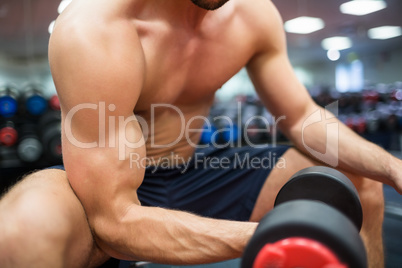Close up of fit man working out with weights