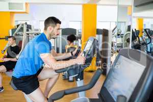 Fit man using the exercise bike