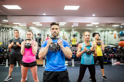 Fit people working out in fitness class