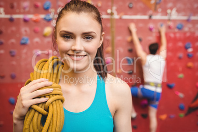 Fit woman at the rock climbing wall