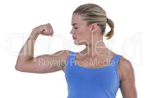 Muscular woman flexing her muscle