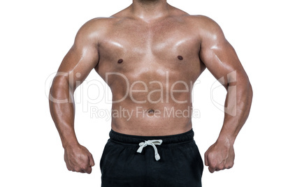 Muscular man flexing for camera