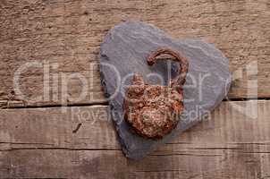 Rusty padlock on a heart shape