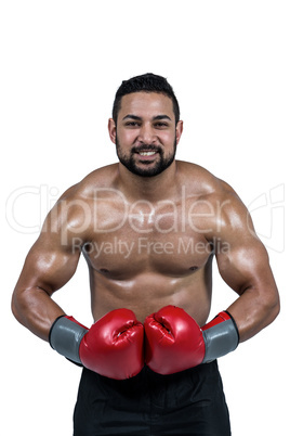 Muscular man boxing in gloves