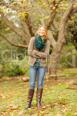 Smiling woman with arms crossed