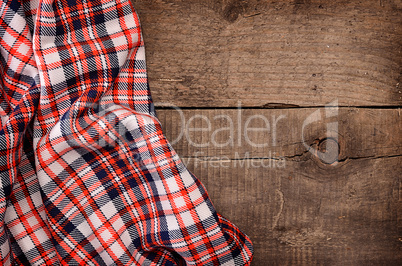 Checkered table cloth on wood