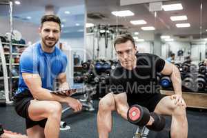 Fit man working out in weights room