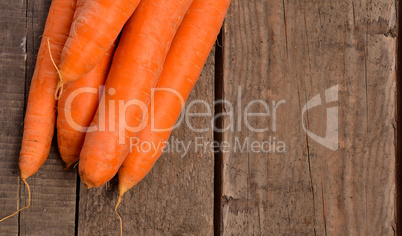 Fresh carrots on wood