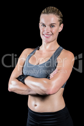 Muscular woman with arms crossed