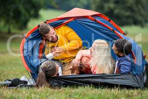 Happy friends in their tent