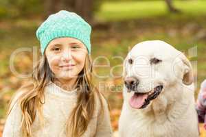 Smiling young girl with her dog