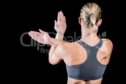 Muscular woman with arms crossed