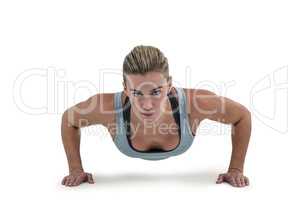 Muscular woman doing push-ups