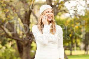 Smiling pretty woman having a phone call