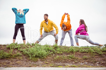 Friends stretching before a hike