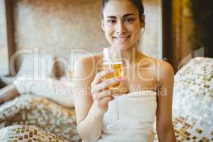 Smiling woman holding a glass of champagne