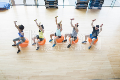 Fitness class exercising in the studio