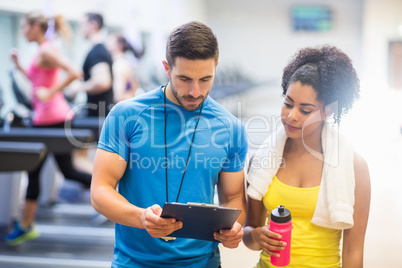 Fit woman talking to her trainer