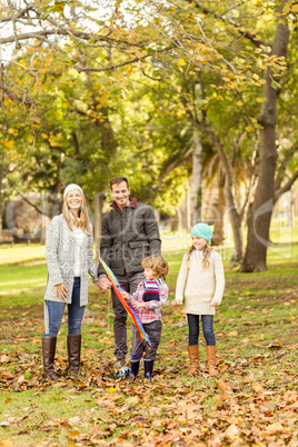 Young family playing with a kite