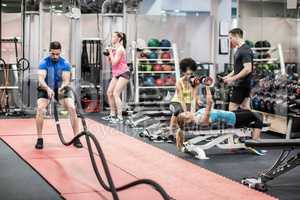 Fit people working out in weights room