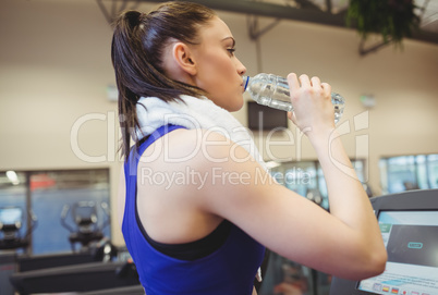 Fit woman taking a drink