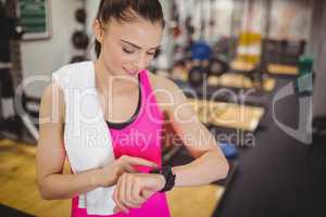 Fit woman using her smartwatch