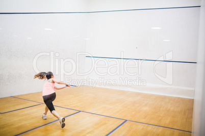 Woman playing a game of squash